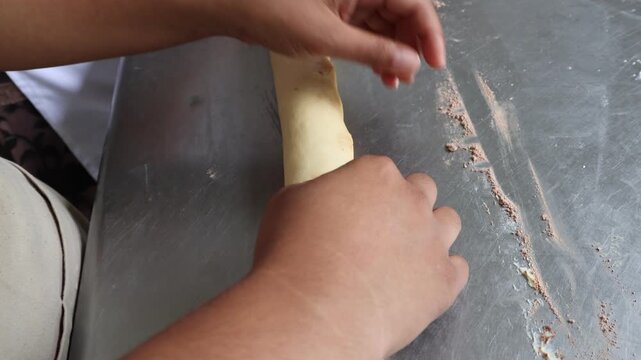 Close Up of Baker Hands Kneading Dough for Homemade Artisan Bread