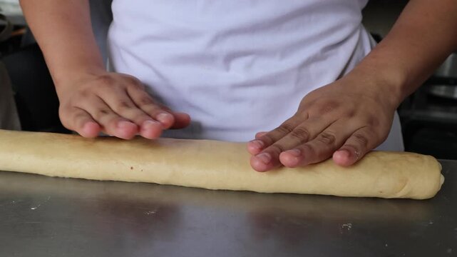 Close Up of Baker Hands Kneading Dough for Homemade Artisan Bread