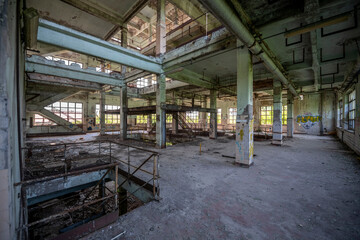 Abandoned distillery tower in Italy – circular industrial building with glass dome, steel beams, panoramic windows, decaying factory interior, urban exploration, post-industrial architecture
