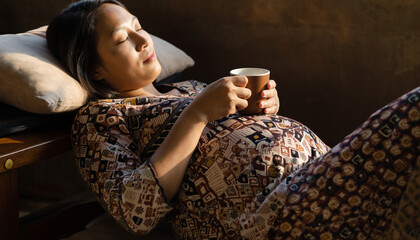 Expecting Mother Relaxing with Drink Serene Pregnancy Moments