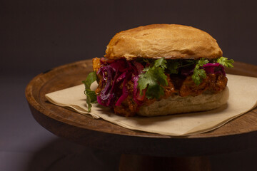 Colorful slaw on artisan bun, Golden crusted chicken with crunchy slaw, Delicious crispy chicken sandwich topped with tangy mayo and colorful shredded cabbage