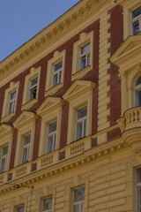 Sunlit ornate facade with detailed architecture, Heritage restoration scene showcasing intricate design