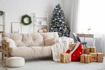 Interior of living room with sofa, Santa bag and Christmas presents