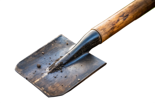 Close up of a garden spade with soil on black background