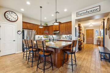 A kitchen with wood cabinets, a white stove, and granite tops