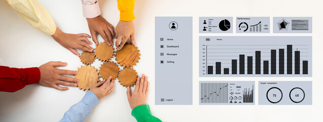 A group of diverse hands work together over wooden gears beside a digital performance dashboard, illustrating teamwork and collaboration in a modern office environment. Axiom