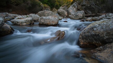 Serene Mountain Stream Flowing Over Rocks at T