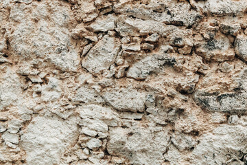 Texture of a rock made of stones of irregular shape and size.