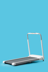 Modern treadmill on blue background