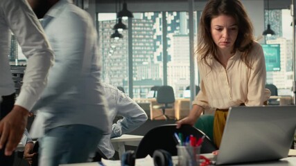 Employees reviewing data visualization to meet project objectives for progress. Colleagues share charts and analytics in a modern corporate environment to improve forecasting. Camera B. - Powered by Adobe