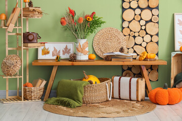 Interior of room with wooden bench, shelf and autumn decor