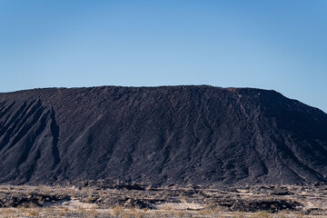 Basalt Flow / Volcanic rocks. Amboy Crater / dormant cinder cone volcano,lava field. San Bernardino County, California. Mojave Desert / Basin and Range Province	
