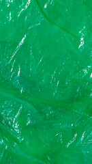 green crinkle foil. texture or background