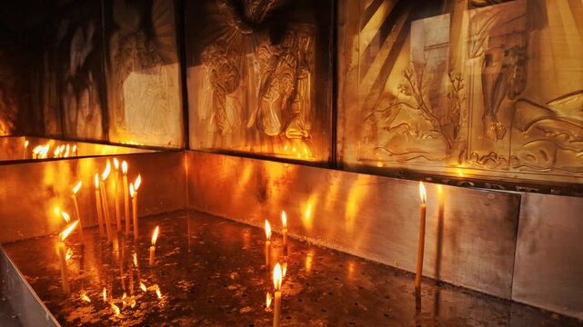 Religious candles inside an Orthodox monastery, warm glow, soft wax and gentle light in a quiet chapel