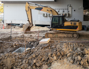 Excavator Working at Urban Construction Site for Metro Station.
