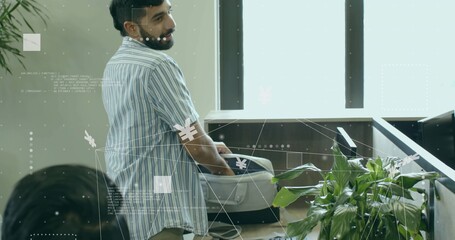 Male wearing shirt placing suitcase on wooden counter in terminal with plant under digital overlay