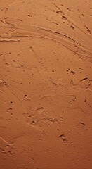 Close-up of a warm, earthy clay floor showcasing its rustic texture and natural tones. Ideal for organic background designs ,rustic ,pattern ,surface