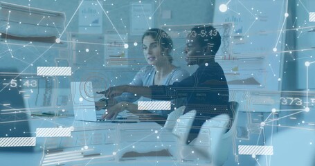 Two women opening laptop activating network overlay in meeting room, analyzing business figures - Powered by Adobe