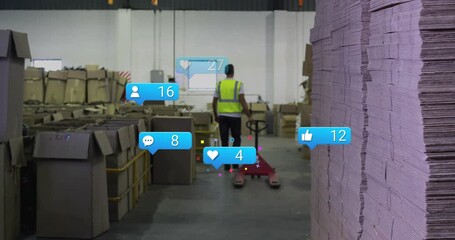 Warehouse worker pushing red pallet jack activating social icons then dispersing at corner - Powered by Adobe