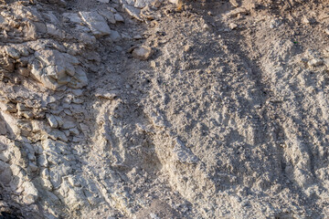 Charlie Brown Outcrop. Cutting or Cut (earthworks). Shoshone in Inyo County, California geology.  devitrified pumice tuff, welded tuff and vesicular vitrophyre. The volcanic rocks are cut by faults. 