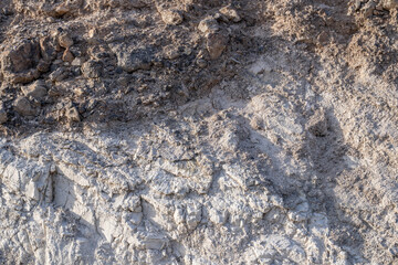Charlie Brown Outcrop. Cutting or Cut (earthworks). Shoshone in Inyo County, California geology.  devitrified pumice tuff, welded tuff and vesicular vitrophyre. The volcanic rocks are cut by faults. 