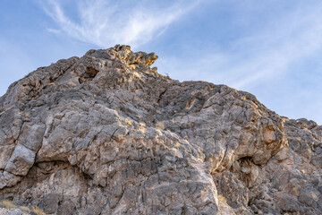 Charlie Brown Outcrop. Cutting or Cut (earthworks). Shoshone in Inyo County, California geology.  devitrified pumice tuff, welded tuff and vesicular vitrophyre. The volcanic rocks are cut by faults. 