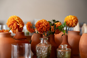 orange cempazuchil flowers in vase