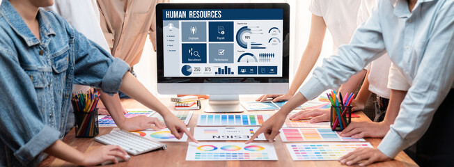 Human resources management software on computer screen helping human resources employee to manage recruitment, payroll, staff searching and KPI evaluation brisk