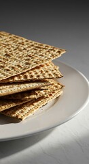 Stack of Matzah on a White Plate.