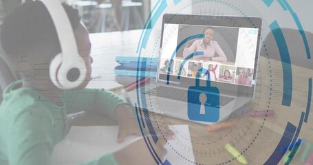 Boy writing in remote class, glancing at teacher on laptop while lock icon expanding across screen - Powered by Adobe