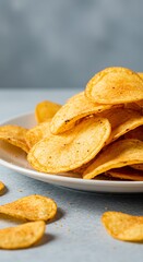 Crispy Potato Chips on a White Plate, Close-Up View.