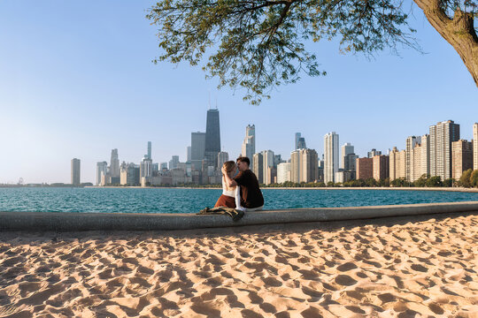 mature caucasian couple on a date. Lake Michigan beach with Chicago landmark view
