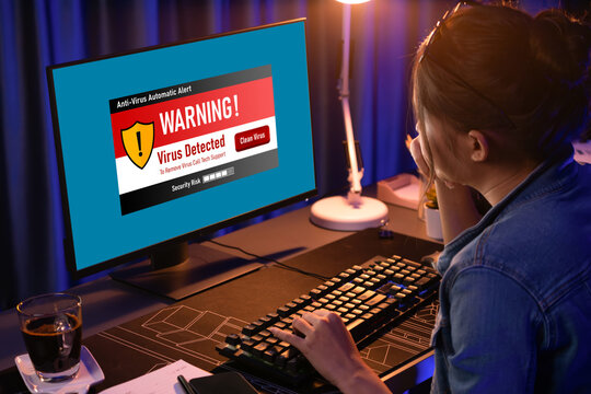 Virus warning alert on computer screen detected brisk cyber threat , hacker, computer virus and malware - Powered by Adobe