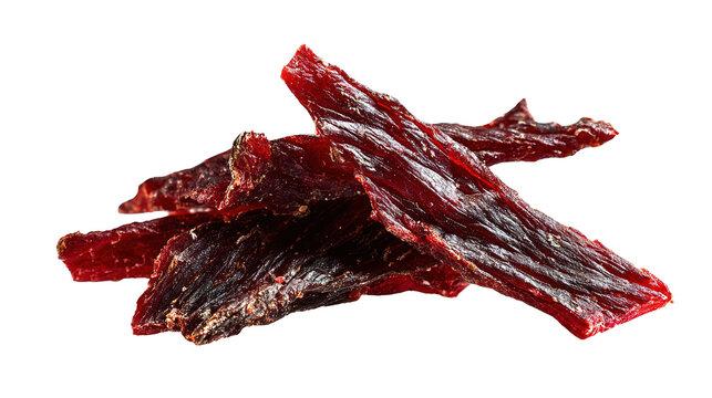 Several thin strips of dried, seasoned beef jerky sprinkled with spices, isolated on a white background