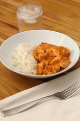 Close-Up of Prepared Chicken Curry and White Rice Dish