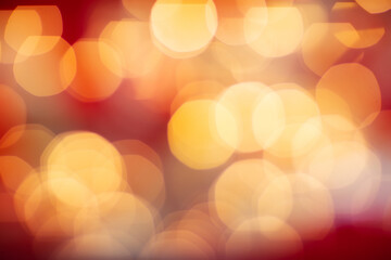 Defocused glowing light spots creating abstract warm bokeh background