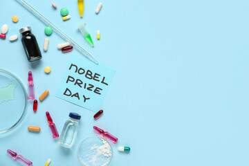 Composition with medicine and NOBEL PRIZE DAY greeting card on blue background. Nobel prize day celebration