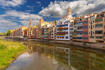 Colorful riverside houses and cathedral in Girona Spain