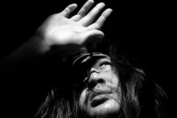 Man Shielding Eyes From Bright Sunlight Indoors