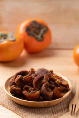 Dried persimmon on wooden plate ready to eating, Sweet and chewy