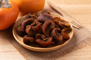 Dried persimmon on wooden plate ready to eating, Sweet and chewy