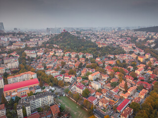 Naklejka premium Top view from the hill of Signal Park of red roofs and cityscape of old town and new town seaside of Qingdao, China