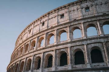 Fototapeta premium Ancient stone amphitheater arches under a clear sky.