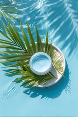 Blue Face Cream in Water with Palm Leaves and Sunlight Reflections