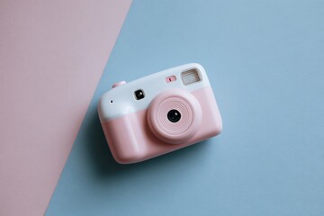 Pink and White Toy Camera on a Blue Background with Hard Shadow