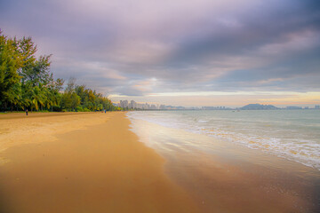 Gorgeous beach lined with palm trees near Sanya