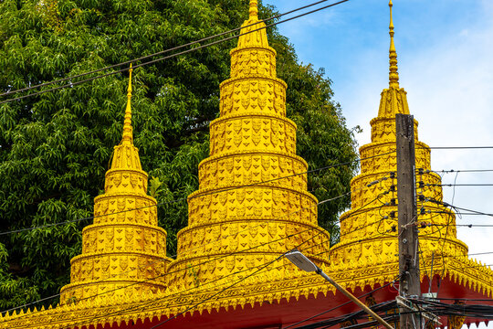 Suwankeereewong Temple wat golden Buddhist architecture details in Patong Thailand.