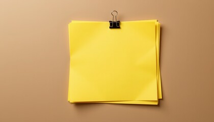 Bright Yellow Sticky Notes Attached With Clip on Smooth Brown Background for Office or Creative Environment