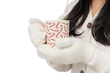 Warm drink held in festive mug with candy cane design, isolated, PNG