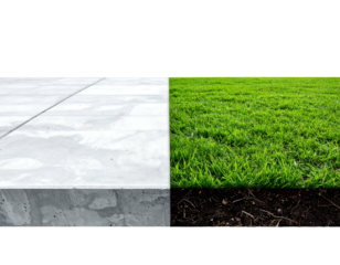 Juxtaposition of surfaces concrete blocks, green grass, and dark soil divided vertically on a black backdrop